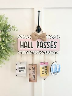 there is a sign that says hall passes hanging on the door