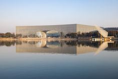 a large building sitting on top of a lake