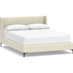 the bed is made up with white sheets and pillows on it's headboard