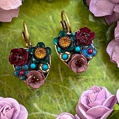 "Lightweight, multicolor floral earrings, handmade with bright and glittering Swarovski crystals and enemel. This classic pair is sure to be a wardrobe staple that will brighten up any look. Item Details: -Materials: Swarovski crystals, glass beads, enamel -Metal: 24K gold electroplated over brass -Size: 1\" long -Lever back -Handmade in our NYC studio -Complimentary gift wrapping -Item Number: S7618 Repairs Policy: Repairs are free. Customers will only be asked to pay $5 for shipping. Expect pr Handmade Multicolor Earrings For Anniversary, Multicolor Jeweled Clip-on Earrings As A Gift, Nyc Studio, Floral Heart, Creating Jewelry, Evil Eye Pendant, Evil Eye Necklace, Floral Earrings, Eye Necklace