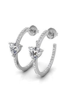 ✥ Introducing our Heart & Round Cut Hoop Moissanite Diamond Earrings for Women, a captivating fusion of romance and elegance. Each earring features a unique design with alternating heart-shaped and round-cut moissanite diamonds meticulously set along the hoop, creating a dazzling display of sparkle and charm. The heart-shaped stones symbolize love and affection, while the round-cut diamonds add a touch of timeless sophistication. These earrings are the perfect accessory to add a touch of glamour Dazzling Halo Design Hoop Earrings As Gift, White Gold Hoop Earrings With Halo Design As Gift, Dazzling Halo Design Hoop Earrings, Hoop Diamond Earrings With Halo Design For Gifts, Heart-shaped Fine Jewelry Hoop Earrings For Anniversary, Anniversary Heart-shaped Fine Hoop Earrings, Gift Halo Hoop Diamond Earrings, Gift Hoop Diamond Earrings With Halo, Sterling Silver Hoop Earrings With Halo Design For Anniversary