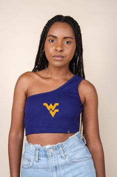 The Senior Top for West Virginia. Classic ribbed-knit tank top with a single shoulder strap. Soft ribbed knit cropped to the waist in a stretch-fit bodycon fit. Comes in white and black. Style it your way! Product details and fit: Bra friendly One Shoulder Cropped Ribbed fabric Slim fitting Stretchy fabric Option to add embroidered logo About the model: Size: S Height: 5’6” Made to order. Made for you ♡ P.S. We'd love to see you repping this style! Don't forget to tag us to be featured *All MTO Trendy College Outfits, Gameday Outfit, University Of Michigan, One Shoulder Tops, Knit Crop, Knitted Tank Top, Knit Tanks, College Outfits, Ribbed Fabric