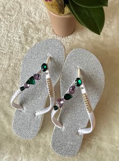 Let your feet shine. Personalized rhinestones trail straps give a delicate look for your feet. Gorgeous crystal string along the straps. Slim flip flops complement your look with all the charm and style for the moments of leisure. The flip flops can be ware for everyday used, great for the beach, shopping or for the gift. Buy with confidence. Please check more items for sell. Thank you for visiting. Adjustable Sandals With Rhinestones For Beach Season, Adjustable Rhinestone Sandals For Beach Season, Silver Open Toe Flip Flops With Rhinestones, Adjustable Silver Open Toe Flip Flops, Adjustable Silver Flip Flops, Silver Rhinestone Open Toe Flip Flops, Silver Flip Flops For The Beach, Silver Open Toe Flip Flops For Beach, Summer Rhinestone Toe Post Flip Flops