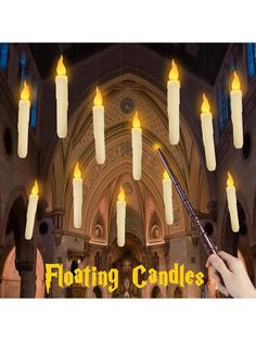 a person holding a stick in front of a church with candles hanging from the ceiling