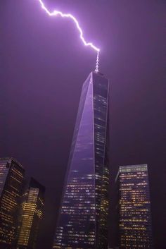 a lightning bolt is seen over the skyscrapers in new york city