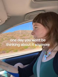 a woman sitting in the back seat of a car with a message on it that reads, one day you won't be thinking about it anymore