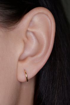 The Demi Hoop Earring is an everyday favorite piece featuring a thick solid gold face. This style offers an edgy look that differs from your regular hoop. 14k solid gold 10mm Wear a silicone backing for extra security when needed. Handmade in NYC Needle Earrings, Nyc Design, Gold Face, Authentic Jewelry, Earring Sale, Edgy Look, Gold Style, Ring Bracelet, Earring Necklace