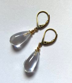 "Crystal clear glass earrings. Clear glass drops, designed by Allen Owen and made for us in Germany. \"Brights 6\" earrings measure 7/8 inches in length. Ear wires are 14k. gold filled or antiqued brass lever backs. All hand work done in the USA. Owen Glass Collection jewelry is ready for gift giving, with earrings backs, an organza bag and description card included. Please let us know if you would like us to make a matching bracelet or necklace of any length. All custom orders are welcome. ♥ Fo Modern Glass Teardrop Earrings, Glass Drop Earrings As Gift, Minimalist Glass Drop Earrings, Elegant Hypoallergenic Glass Earrings, Formal Clear Teardrop Earrings, Nickel-free Clear Minimalist Earrings, Nickel-free Minimalist Clear Earrings, Nickel Free Clear Minimalist Earrings, Minimalist Nickel-free Clear Earrings