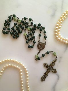 Handmade 6mm green jade gemstone St. Cecilia bronze women's Rosary. Made with green Czech glass flower Our Father beads. St. Cecilia is the patron saint of singers, musicians and the arts. Vintage Green Aventurine Jewelry, Antique Jewelry With 8mm Beads For Gift, Antique Jewelry With 8mm Beads As Gift, Antique 8mm Beads Jewelry As Gift, Green Beaded Rosary With Round Beads, Green Beaded Rosary, Adjustable Green Rosary With Round Beads, Antique 8mm Beads For Jewelry Making, Antique Green Beaded Jewelry