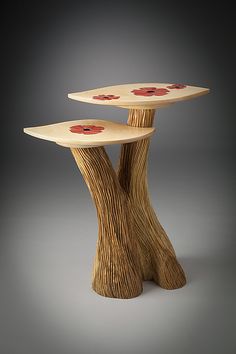 two wooden tables sitting on top of each other