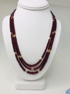 This strand of fine quality spinel beads would be at home in a 19th century ballroom or a 21st century boardroom! Rich, pomegranate red oval rondelles have been hand strung with 22k yellow gold spacers and an 18k yellow gold clasp in an elegant 20-inch strand. I have never seen red spinel beads before! Spinels have often been mistaken for fine rubies throughout history and looking at this strand, it is easy to see why. The beads, graduating in size from 3.00 to 6.50 millimeters, are of the fines Luxury Faceted Beaded Necklace For Formal Occasions, Luxury Formal Faceted Beaded Necklaces, Luxury Formal Faceted Beaded Necklace, Formal Double Strand Beaded Necklace With Faceted Beads, Elegant Garnet Jewelry With Polished Beads, Elegant Rondelle Faceted Beads Necklaces, Formal Ruby Necklaces With Round Beads, Formal Ruby Gemstone Beads Jewelry, Elegant Garnet Necklace With Faceted Beads