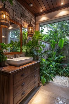 a bathroom with a sink, mirror and potted plants