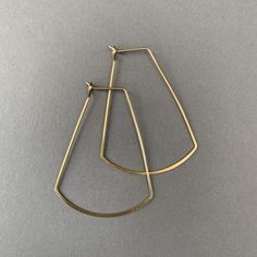 These modern geometric earrings are very versatile. Nickel free & hypoallergenic. Makes a great gift and comes custom wrapped in a box with a polishing cloth and care guide. Dimensions: 33 mm wide 43 mm long Simple Silver Earrings, Custom Wraps, Pretty Stuff, Earrings Minimalist, Wire Earrings, Jewelry Inspo, Geometric Earrings, Gold Hoops, Jewelry Earrings Hoops