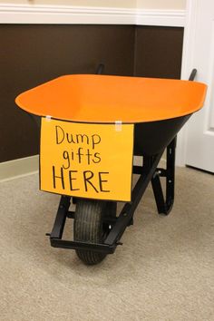 a wheelbarrow with a sign that says dump gifts here