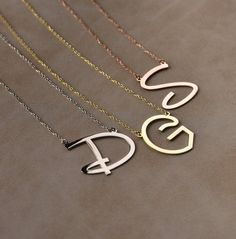 You can customize this necklace with a letter of your choice. All our necklaces are suitable for all kinds of clothing and add a great sparkle to your wardrobe.  #personalizednecklace #weddingift #14kgoldnecklace #personalizedchoker #customnecklace #personalizedjewelry #personalizedgift #namenecklace #initialnecklace #lovegifts #personalizedpendant #birthdaygiftromantic #romanticgifts #giftsforbestfriend Stainless Steel Initials Name Necklace, Customized Letter Necklaces, Customizable Stainless Steel Initial Pendant Jewelry, Initial Pendant Necklace With Letter Print For Gift, Minimalist Customized Initial Pendant Necklace, Customized Minimalist Initial Pendant Necklace, Monogram Initial Necklace As Gift, Customized Minimalist Initial Necklace As Personalized Gift, Letter Print Initial Pendant Necklace As Gift