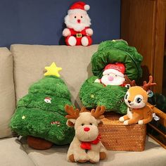 stuffed animals and christmas trees on a couch