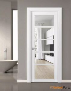 an open door in a room with white walls and wood flooring on the side