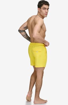 Soak up the sun in these recycled-fiber swim trunks built with UPF 40+ sun protection. 5" inseam (size Medium) Elastic/drawstring waist Front slant pockets; back patch pocket Lined 100% REPREVE polyester REPREVE recycled polyester is made from 100% post-consumer recycled plastic bottles Machine wash, tumble dry Imported Drawstring Bottoms For Beach Season, Drawstring Bottoms For Outdoor Beach Season, Beach Season Drawstring Bottoms For Outdoor, Nylon Swimwear With Pockets For Summer, Relaxed Fit Swim Trunks With Pockets For Beachwear, Relaxed Fit Nylon Swim Trunks For Poolside, Swim Trunks With Functional Drawstring, Nylon Swim Trunks For Beach, Nylon Short Length Swim Trunks For Beach