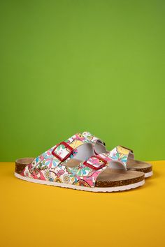 Take your beach style to the next level with MAIBULUN's Lovey Dovey Floral Printed Double Strap Sandal! Inspired by the carefree boho vibes, this sandal is sure to turn heads with its cheerful floral prints and double strap design. So rock it and make a statement! Slip-on / buckle closure Cushioned footbed Man-made leather upper Man-made lining EVA sole Trendy Floral Print Beach Sandals, Summer Floral Print Beach Sandals, Floral Print Sandals For Beach Season, Beach Sandals With Floral Print And Flat Sole, Bohemian Flip Flops For Spring Festival, White Bohemian Sandals For Beach Season, Spring Festival Bohemian Flip Flops, Bohemian Multicolor Flip Flops For The Beach, White Bohemian Flip Flops For Vacation