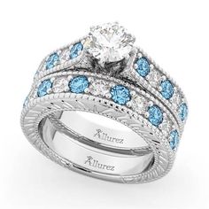 a wedding ring set with blue and white stones