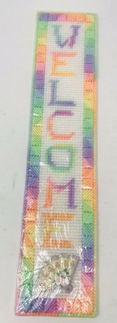 there is a plastic tag with the word hello written on it in multicolors