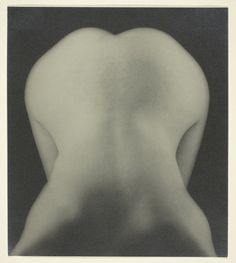 the back of a nude woman's body is shown in this black and white photo