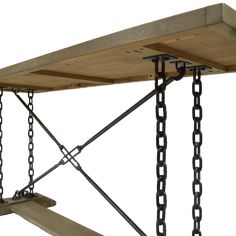 a wooden shelf with chains hanging from it's sides and two hooks on each side