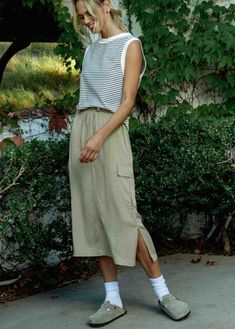 wishlist cargo midi skirt with side slit elastic waist drawstring cargo pocket taupe tan Cargo Midi Skirt, Thrift Inspo, Cargo Skirt, Midi Length Skirts, Cargo Pocket, Summer Ready, Comfort Style, Pocket Detail, Comfortable Fashion