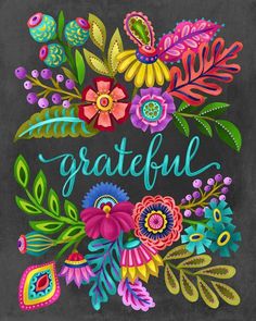 a chalkboard with the words grateful written in colorful flowers and leaves on it's side