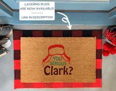 a door mat with the words you serious clark on it next to a pair of slippers