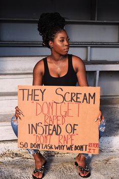 a woman sitting down holding a sign that says they scream don't forget the instead of