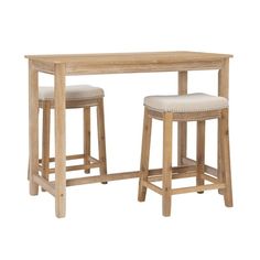 a wooden table with two stools and a white cushion on the bottom one side