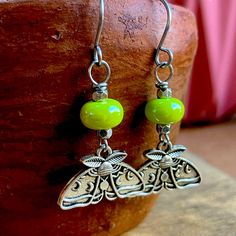 These Dainty Little Earrings Feature Beautiful Ceramic Green Beads And Moth Charms. All Earrings Feature Handmade And Hand Filed Stainless Steel Ear Hooks. Found Object Jewelry Earrings, Little Earrings, Green Beads, Ear Hook, Green Bead, Charm Earrings, Handcrafted Jewelry, Moth, Jewelry Crafts