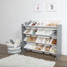 a baby's playroom with stuffed animals and toys on the shelves in front of it