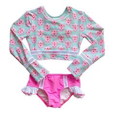 We just love this long sleeve two piece bikini. A cute crop top with key hole and tie back for easy on and off. Lots of details on the full coverage bottoms with ruffles will make this a favorite in our collection always. Who doesn't love a long sleeve kini with sun protection?! SPF 50+ Sizing: This suit runs true to size. 6 Months - 1 Year 1 Year - 2 Years 2 Years - 4 Years 4 Years - 6 Years 6X 8 Years 10 Years 12 Years Cute Crop Top, Pink Friday, Cute Crop Tops, Key Hole, Rash Guard, Spf 50, Tie Backs, Tie Back, Love A