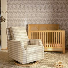 a baby's room with a rocking chair and crib