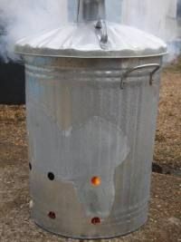 a large metal barrel with some steam coming out of it's top and bottom