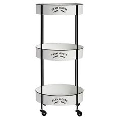 three tiered shelf on wheels with white labels and black handles, each displaying the same product