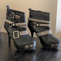 Hard To Find...These Are Beautifully Embellished Boots With Buckles...Rock ‘N’ Roll Style Feel. They Will Look Great With Jeans Or A Skirt For Your Night Out. Sold Originally For Over 500. Pour La Victoire, Jeannie, Women's Leather Ankle Boots, Studded, Black, Buckle Adjustment On The Ankle, Leather And Gunmetal Buckles And Studs, Around Toe With Metal And Studs In Front. High Heel Stiletto 4.5". Very Comfortable, Traction Platform Sole, Silver Metal Studs And Buckles. Leather Party Heels With Rivets, Edgy Pointed Toe Heels For Concert, Edgy High Heel Moto Boots With Metal Feet, Edgy Moto Boots With Metal Feet For Parties, Punk High Heel Moto Boots For Party, Punk Ankle Boot Heels For Night Out, Punk Style High Heel Moto Boots For Parties, Edgy Round Toe Moto Boots For Party, Punk Style Ankle Boot Heels For Night Out