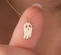 It is one of Onseva's products with the highest customer satisfaction, designed specifically for Halloween and for cute ghost lovers!  Our ghost necklace is 14k solid gold. It belongs to the Onseva Halloween collection. You should not miss any product in this collection, which will be on sale only in limited numbers and for a short time. Everyone from 7 to 70 will love our cute ghost necklace.  This gold Halloween necklace is the perfect gift choice for your loved ones for Halloween or other special occasions like Christmas! 👻 🎁 If you want, you can add a gift note for your loved ones. It arrives in a special jewelry gift box. ✨ We respond to your questions happily. Your question will be answered within 24 hours. Do not hesitate to contact us. 💎 I hope you have a lot of Onseva's designs White Halloween Necklace Gift, White Necklace For Halloween Gift, Halloween Novelty Necklaces As Gift, White Jewelry Gift, Ghost Necklace, Mini Ghost, Gold Halloween, Halloween Pendant, Pendant Ideas