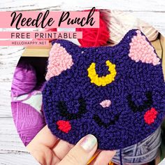 a crocheted cat coin purse is shown with the text needle punch free printable