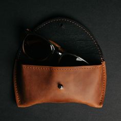 An eyeglass case is an incredibly useful accessory that will protect your glasses. You can carry it in your backpack, bag, or even in your hands. It will become a bright element of your look and can even become its highlight. You no longer need to worry about your glasses getting scratched or broken. A handmade glasses case is an ideal gift, an accessory without which modern people cannot imagine sunny days and vacations. You can use it in everyday life, take it with you to work and university, Leather Round Case For Everyday Use, Modern Brown Travel Accessories For Daily Use, Functional Brown Everyday Cases, Everyday Leather Wallet, Brown Leather Travel Accessories As Gift, Modern Brown Cases For Everyday Use, Modern Brown Everyday Cases, Leather Eyeglass Cases, Modern People