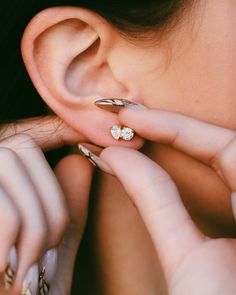 a close up of a person with ear piercings