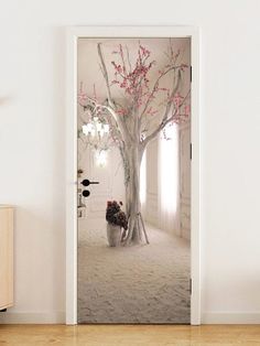 an open door with a tree and flowers in it