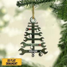 a christmas tree ornament with wrenches hanging from it