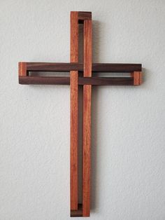 a wooden cross hanging on the wall