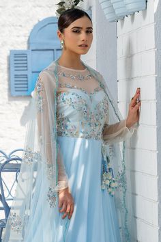 Sky blue floor length anarkali with sequin embroidered bodice in stripe pattern. Paired with dupatta.
Components: 2
Pattern: Embroidery
Type Of Work: Sequin, stripe
Neckline: Illusion sheer
Sleeve Type: Sheer sleeves
Fabric: Georgette
Color: Blue
Other Details: 
Sheer panelled yoke
Scallop bordered dupatta
Back keyhole
Occasion: Destination Wedding - Aza Fashions Blue Floor-length Gown For Eid, Floor-length Saree With Sheer Dupatta For Reception, Blue Gown With Resham Embroidery In Maxi Length, Blue Resham Embroidered Maxi Gown, Blue Floor-length Gown With Resham Embroidery, Blue Gown With Resham Embroidery, Floor-length Semi-stitched Salwar Kameez With Dori Work, Blue Anarkali Gown With Zari Work, Blue Georgette Maxi Lehenga