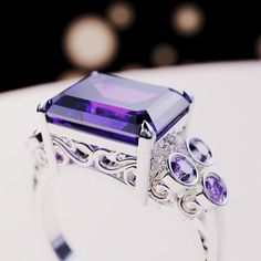 Introducing The Violet Love: This bold statement ring is perfect for any occassion. As a gift for her, a wedding ring or a gift for yourself - because you deserve it - it is guaranteed to impress. This ring is made as a 3-in-1 triple ring set. 2 perfectly fitting bands to complement the big bold center main ring. A bold and beautiful simulated amethyst sits like a crown in the center of a gemstone halo. The sides covered with beautiful simulated diamonds and purple enamel. Underneath you have pr Elegant Open Amethyst Ring, Luxury Purple Jewelry Gift, Cubic Zirconia Rings For Mother's Day Gift, Stamped 925 Rings For Mother's Day Wedding, Elegant Amethyst Ring With Cubic Zirconia For Gift, Elegant Purple Amethyst Ring For Gift, Elegant Amethyst Open Ring For Wedding, Elegant Rings With Accent Stones As Gift, Elegant Open Amethyst Ring For Wedding