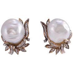 Vintage GIA certified baroque South Seas pearl clip earrings, circa 1935. These 14 karat yellow gold earrings feature two baroque South Sea pearls at approximately 14.50mm each, GIA cert #1176003511. They are accented with 38 single cut diamonds at .33 carat total weight. The diamonds have SI1 clarity and H color. These earrings are appraised at $7,038. [MICO 694] Dimensions 20mm H x 17.5mm W Yellow Gold Baroque Pearl Earrings, Formal Yellow Gold Baroque Earrings, Formal Baroque Pearl Earrings For Pierced Ears, Formal Baroque Yellow Gold Earrings, Baroque Pearl Earrings For Anniversary, Classic Yellow Gold Baroque Earrings, Classic Baroque Yellow Gold Earrings, Classic Baroque Earrings For Formal Occasions, Classic Baroque Earrings For Formal Events