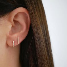 The Gold Mini Bar Stud Earring keeps every stack right in line. Featuring a solid 14k gold bar, this shiny stud can be angled left, right, up, down—and definitely around town. Tiny Diamond Earrings, Earring Inspo, Huggie Earring, Love Sparkle, Bar Stud Earrings, Bar Studs, Diamond Glitter, Eternity Band Ring, Diamond Bar